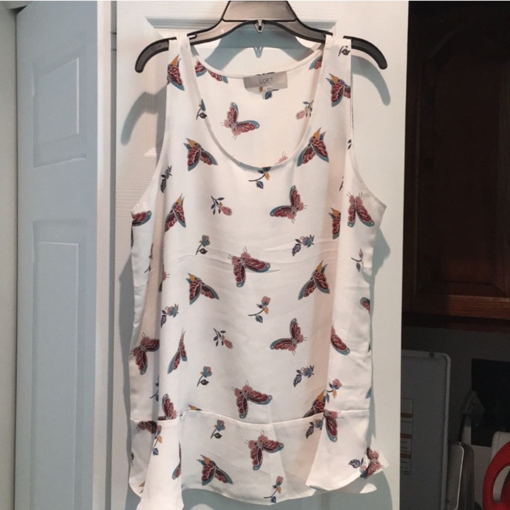 Loft sleeveless top with peplum bottom.
